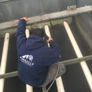 A industrial cooling tower with water droplets falling.